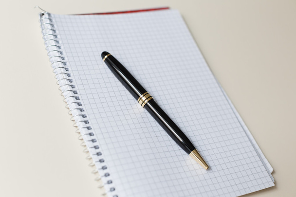black pen with white pad or notepad - Fotó, kép