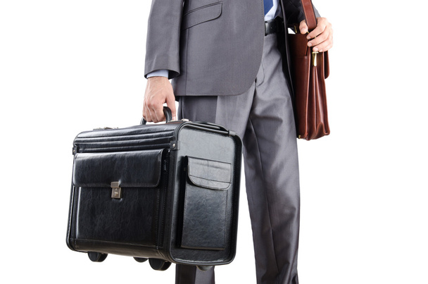 Businessman with suitcase travelling - Foto, Bild