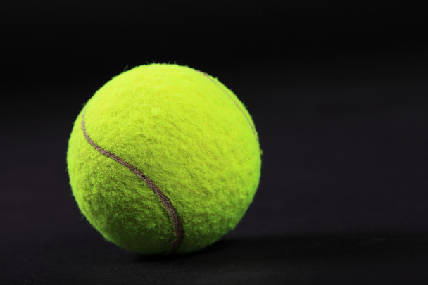 Tennis balls on black background studio shot - Fotó, kép