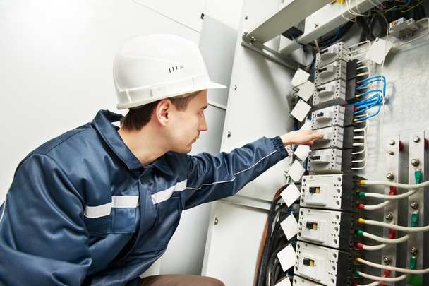 Electrician switching on power line box - Photo, Image