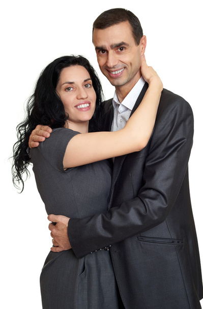 Šťastný pár oblečený v klasické oblečení, portrét ve studiu na bílém pozadí  - Fotografie, Obrázek