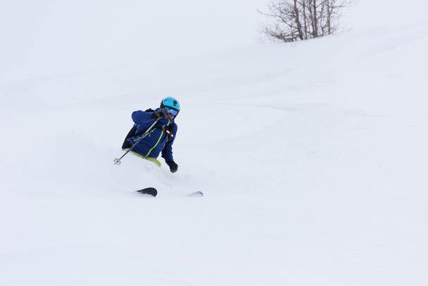 freeride skier skiing in deep powder snow - Foto, imagen
