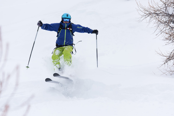 freeride skier skiing in deep powder snow - Фото, зображення