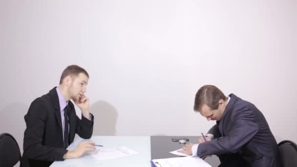 businessman talking on the phone. colleague tells lyrics. Negotiation - Footage, Video