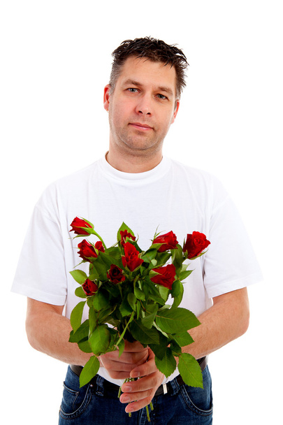 Handsome man is giving bouquet of roses - Zdjęcie, obraz