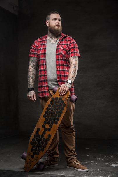 bearded man with longboard. - Photo, Image