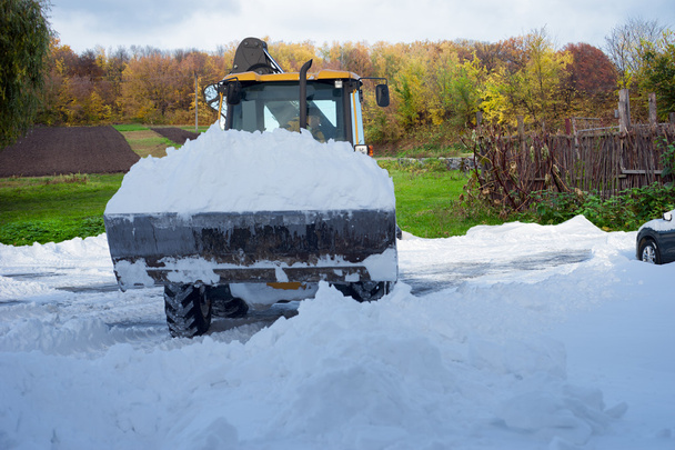 Tractor cleaning snow in field - Photo, Image