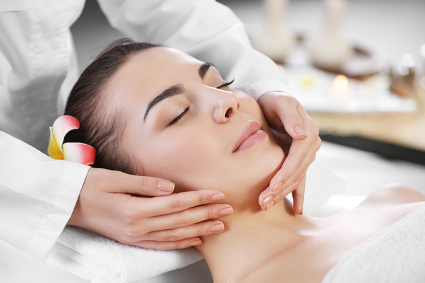 woman relaxing with face massage  - Photo, image