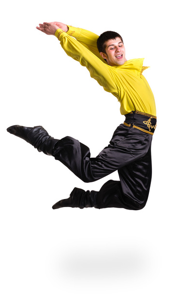 Jumping man wearing a toreador costume. Isolated on white in full length. - 写真・画像