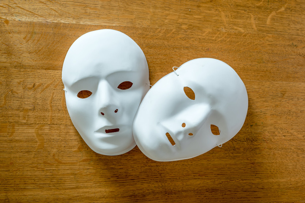 Two masks on a wooden background - Photo, Image