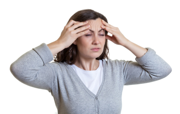Caucasian woman with dark hair has a migraine - Фото, изображение
