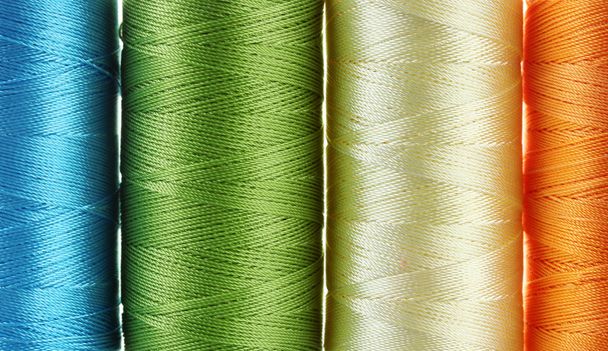 Bright bobbin thread close up - Фото, изображение