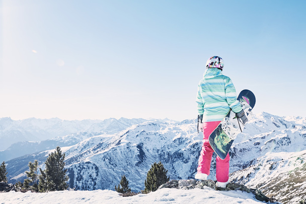 Young woman with snowboard - Foto, Bild