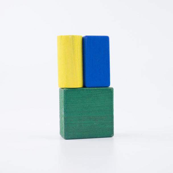 The wooden house. Children's toys - wooden cubes on a white background - Foto, Imagem