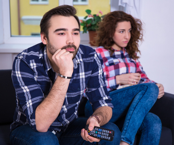 woman being bored watching tv with boyfriend - Photo, Image
