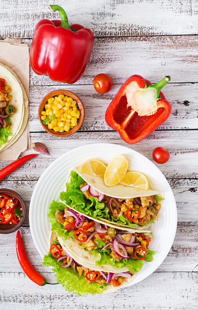 Mexican tacos with meat, corn and olives on wooden background - Photo, Image