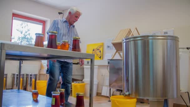 couple is looking at how honey is made - Footage, Video
