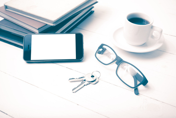 coffee cup with phone,key,eyeglasses and stack of book vintage s - Fotoğraf, Görsel