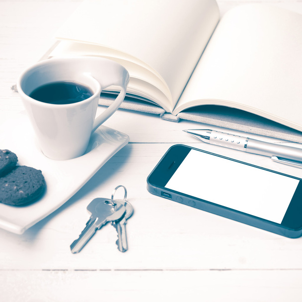 coffee cup with cookie,phone,notebook and key vintage style - Φωτογραφία, εικόνα