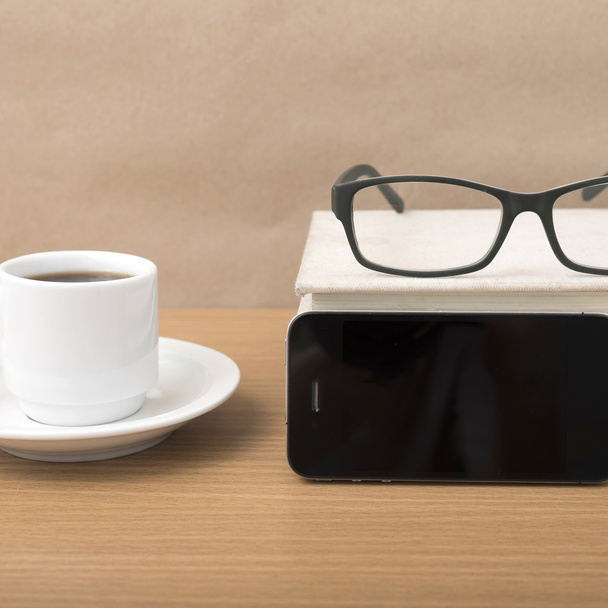 coffee,phone,stack of book and eyeglasses - Фото, изображение