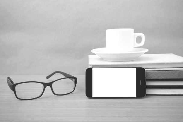 coffee,phone,stack of book and eyeglasses - Fotó, kép