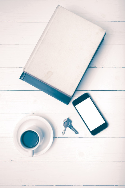 coffee cup with phone,key and stack of book vintage style - Φωτογραφία, εικόνα