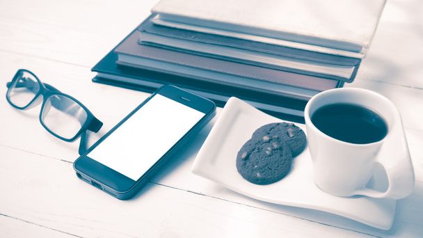 coffee cup with cookie,phone,stack of book and eyeglasses vintag - Photo, Image