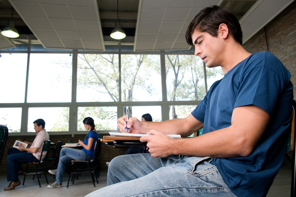 Man studying in the class - Foto, afbeelding