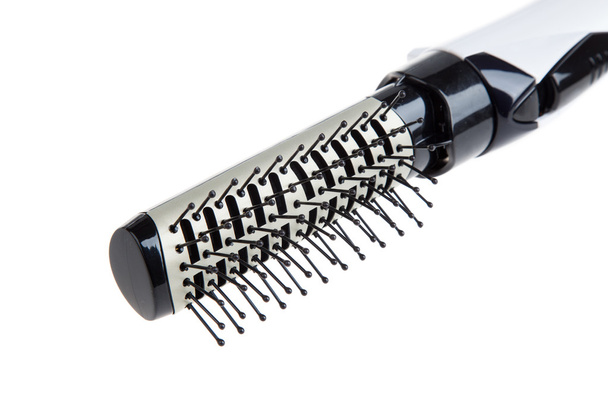 Primer plano de cepillo de pelo único, aislado en blanco. Equipo y herramientas profesionales de peluquería
 - Foto, imagen