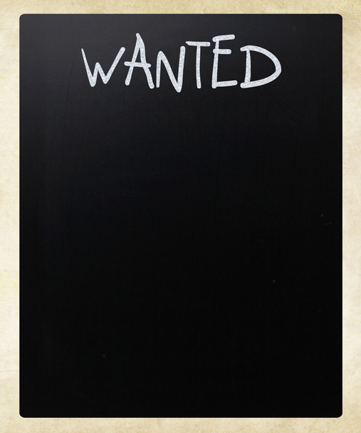 "Wanted" handwritten with white chalk on a blackboard - Photo, Image