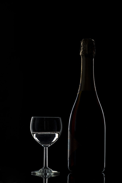 A bottle of champagne and a glass of wine - Fotografie, Obrázek