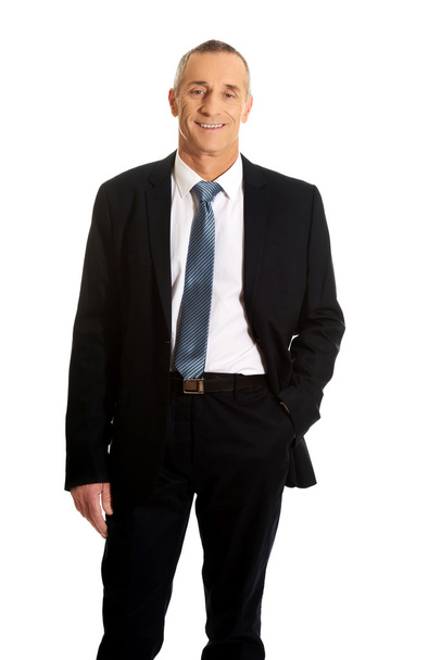 Smiling businessman with hand in pocket - Photo, Image