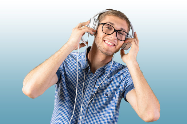 Handsome young man listening to music - Fotografie, Obrázek