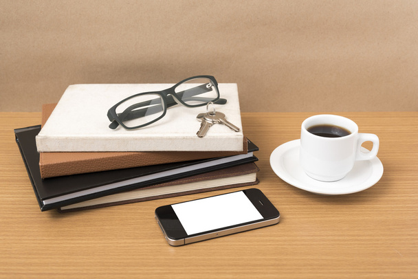 coffee,phone,key,eyeglasses and stack of book - 写真・画像
