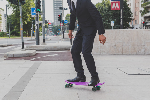 Young handsome Asian model posing with his skateboard - Φωτογραφία, εικόνα