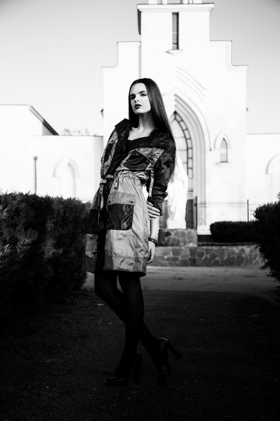 Young woman standing outdoors. fashion portrait. Black and white - Foto, Imagem