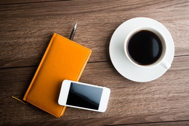 Organizer with cup of coffee and mobile phone - Photo, Image