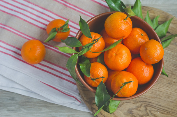 Ripe tangerines on canvas background - Fotó, kép