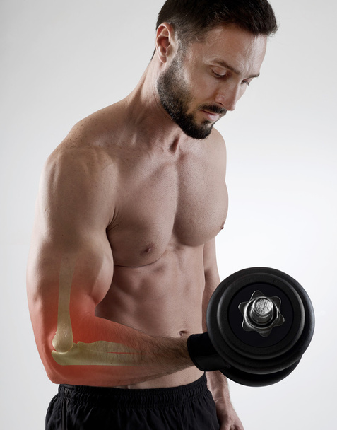 Weightlifting injury, gray background - Photo, Image