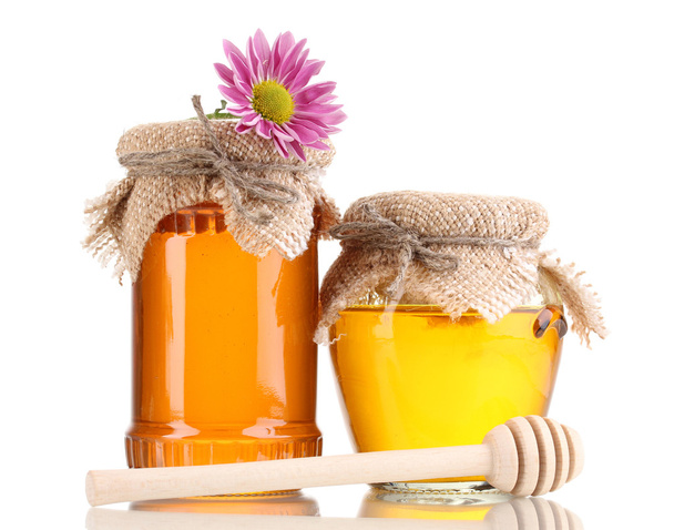 Sweet honey in jars with drizzler isolated on white - 写真・画像