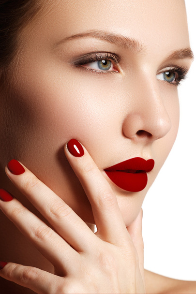 Sexy lips. Beauty red lips makeup detail. Beautiful make-up closeup. Beautiful fashion model girl face. Perfect skin. Make up. Red manicure - Foto, Imagem