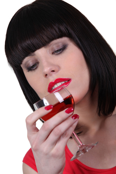 Woman drinking a glass of wine - Photo, image