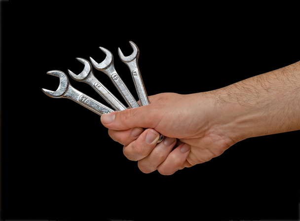 Open-ended wrenches in hand - Foto, afbeelding
