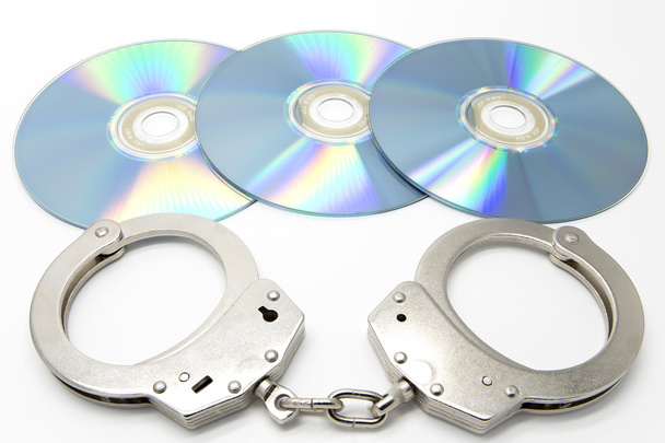 наручники та оптичні диски
 - Фото, зображення