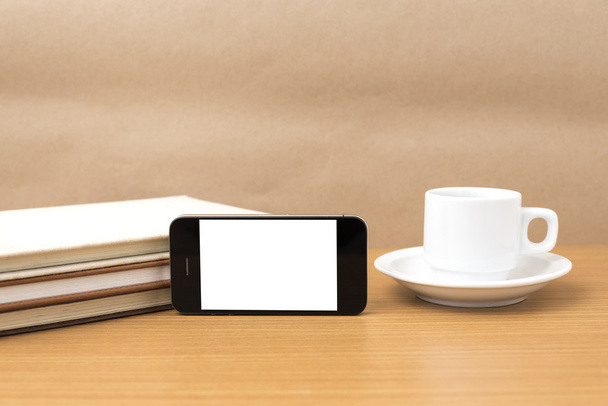 coffee cup and phone and stack of book - Фото, изображение