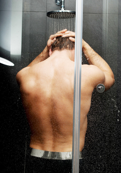 Handsome man at the shower. - Фото, изображение