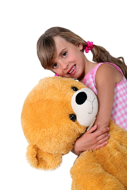 Little girl with toy bear - Фото, изображение