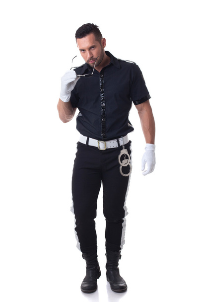 Trendy cop posing at camera, isolated on white - Photo, image