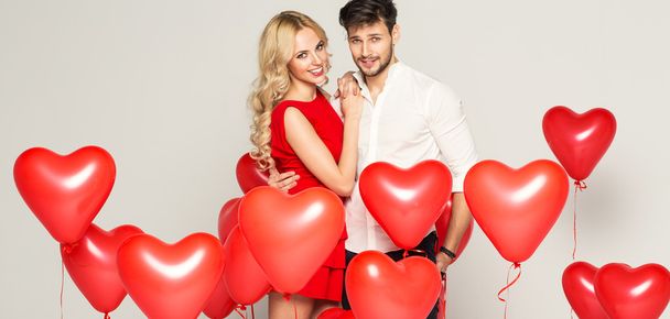 Valentine's photo of young loving couple with balloons - Foto, imagen