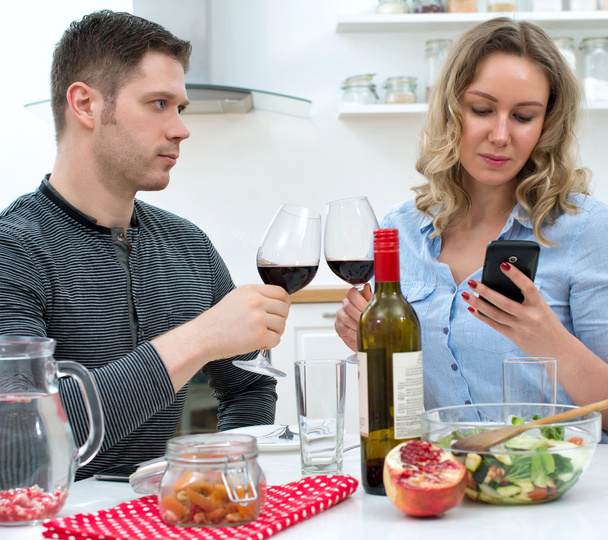 Young couple having dinner at home. Modern dating. - Φωτογραφία, εικόνα